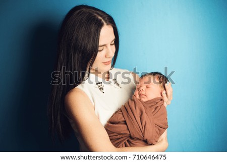 newborn baby mom hands on