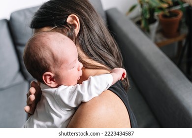 Newborn Baby On Mother's Shoulder Passing Gas After Feeding