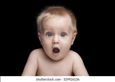 newborn baby portrait with funny shocked face expression