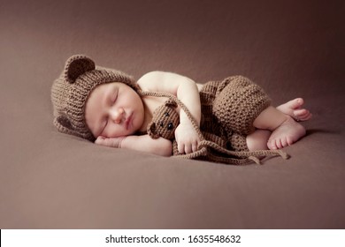 Newborn baby session. Child baby portrait . Sweet tot little child on a blanket background. Newborn with teddy bear - Shutterstock ID 1635548632