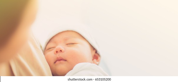 Newborn baby sleep first days of life.Mother day concept.