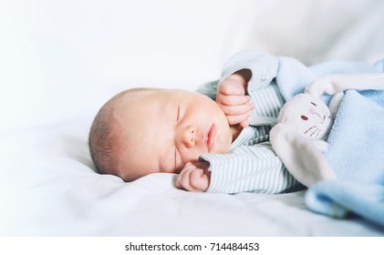 Newborn baby sleep first days of life. Cute little newborn child sleeping peacefully