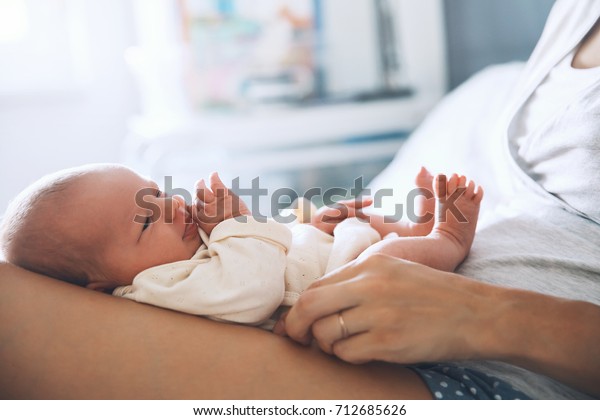 baby holding bed