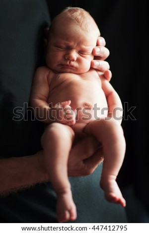 Similar – Baby yawning lying on a carpet