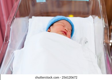 Newborn Baby Sleeping In The Delivery Room.