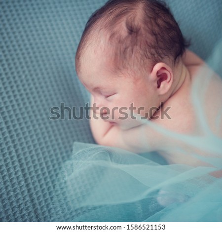 Similar – Newborn sleeping lying on blanket