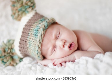 Newborn baby sleeping. Soft focus, shallow DoF.