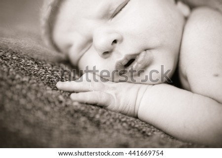 Similar – Image, Stock Photo Newborn baby with pompom hat sleeping and laughing on blanket