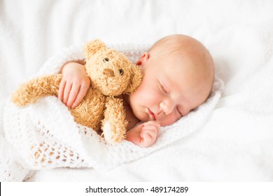 Newborn Baby Sleeping With Teddy Bear