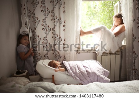 Similar – Happy boy jumping and playing over the bed with his family in a relaxed morning. Weekend family leisure time concept.