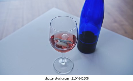 Newborn Baby Sucker Floating In Glass Of Rose Wine Left On Table By Addicted Drinking Breastfeeding Or Expecting Mother Risking Development Of Fetal Alcohol Spectrum Disorder