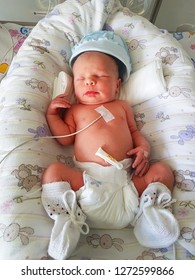 Newborn Baby With Vital Signs Sensors