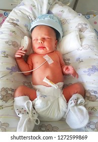 Newborn Baby With Vital Signs Sensors