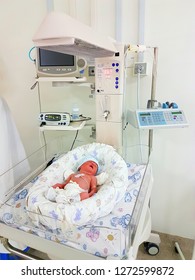 Newborn Baby With Vital Signs Sensors