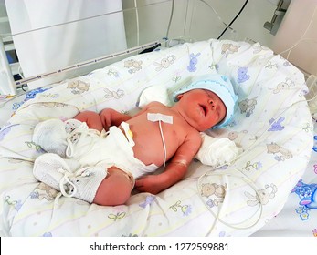 Newborn Baby With Vital Signs Sensors