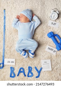 Newborn Baby Weight And Length. Sleeping One Month Child In Blue Bodysuit Lying On Fluffy Carpet. Babies Clothes Size Measurement. Kid Growth Development And Health Care