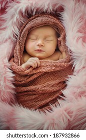 Newborn Baby in Wrap and Blanket