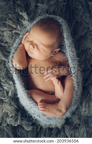 Similar – Newborn baby girl sleeping lying on bed next to mother’s hand