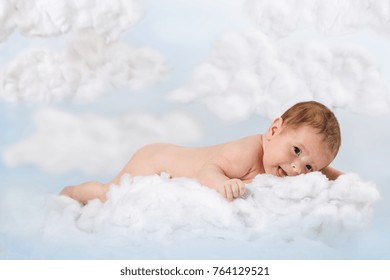 A Newborn Child Lies On A Cloud Of Cotton Wool