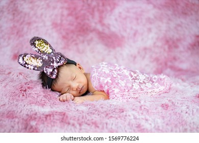 Newborn Cute Baby Infant On Pink Wool Shag Rug Background