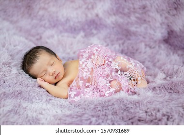 Newborn Cute Baby Infant On Wool Shag Rug Background