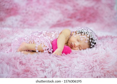 Newborn Cute Baby Infant On Wool Shag Rug Background