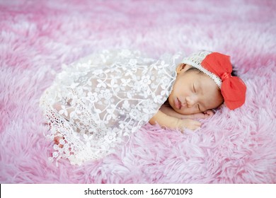 Newborn Cute Baby Infant On Wool Shag Rug Background