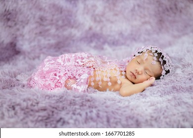 Newborn Cute Baby Infant On Wool Shag Rug Background