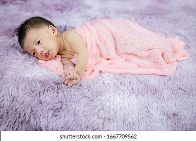 Newborn Cute Baby Infant On Wool Shag Rug Background