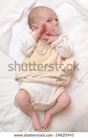 Similar – Image, Stock Photo Baby lies on a blanket and covers his eyes with his hands