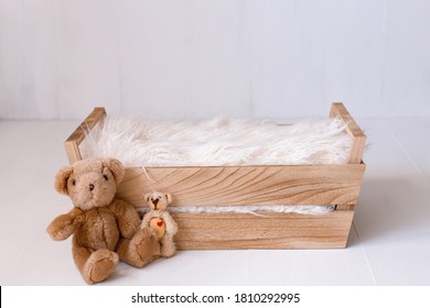 Newborn digital background with bears and wooden crib, front view and selective focus.