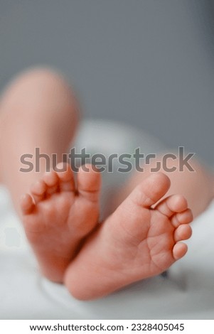 Newborn feets closeup, natural colours