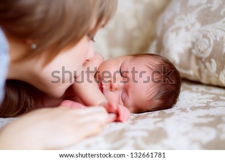 Similar – Mother and cute little baby girl sleeping