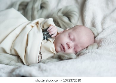 newborn girl on a blanket