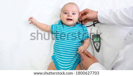 Newborn hearing screening and diagnosis at the hospital. Baby having hearing screening, Otoacoustic Emissions