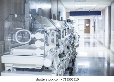 Newborn infant incubator boxes in a hospital corridor