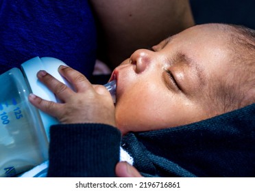 A Newborn Latino Baby Drinking Milk