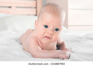 Newborn Lies On Stomach Close Up. Baby Care Concept.