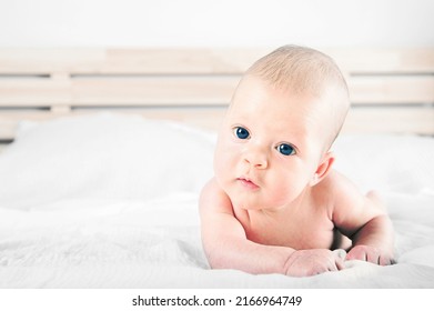 Newborn Lies On Stomach Close Up. Baby Care Concept..