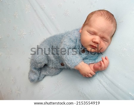 Similar – Image, Stock Photo Baby lies on a blanket and covers his eyes with his hands