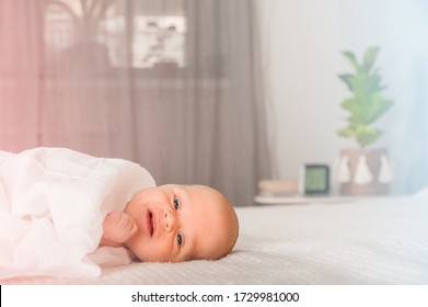 Newborn On The Bed. Crying, Screaming Baby Close Up And Copy Space. Baby Smile And Colic In Newborns. Seborrheic Dermatitis In Newborns