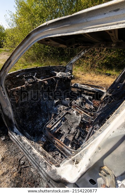 Newburn UK:\
29th April 2022: A stolen car which has been burnt out and dumped\
in a field. Small car fire\
interior