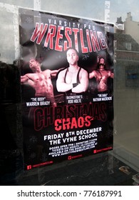 Newbury, Berkshire, England - November 16, 2017: Varsity Pro Wrestling Advertising Poster Taped To Vacant Shop Window