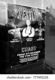 Newbury, Berkshire, England - November 16, 2017: Monochrome Varsity Pro Wrestling Advertising Poster Taped To Vacant Shop Window