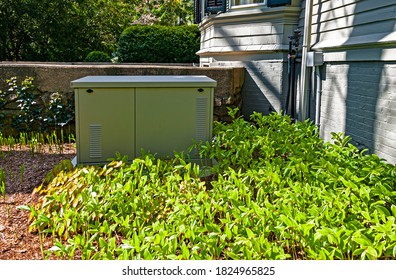 Newbury, MA - May 10, 2017: Residential Standby Generator Installed On A Concrete Pad