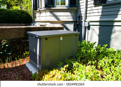 Newbury, MA - May 10, 2017: Residential Standby Generator Installed On A Concrete Pad