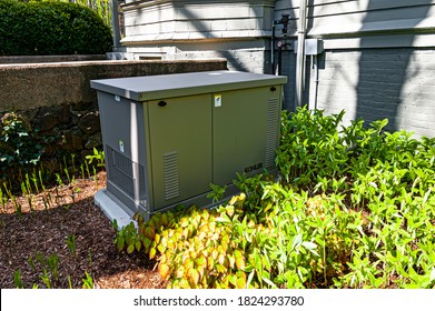 Newbury, USA - May 10, 2017: Residential Standby Generator At The House Wall