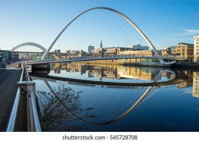 NEWCASTLE, ENGLAND - DECEMBER 29 2016: Gateshead Millennium Bridge with the Baltic Centre for Contemporary Art. The bridge spans the River Tyne in north east England.
