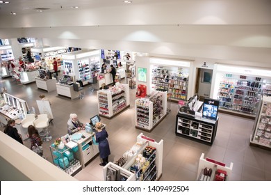 Newcastle / England - Mar 18, 2019 : View of costetics department in large store with customers.  Retail environment.