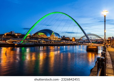 Newcastle and Gateshead at sundown showing Gateshead Millennium Bridge , sage and Tyne Bridges.